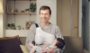 Buttigieg nursing a child.png